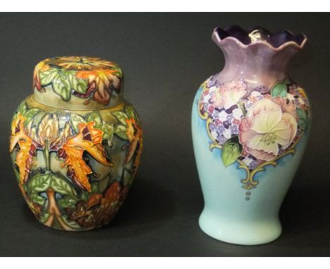 A modern Moorcroft ginger jar with tube lined floral decoration, bearing initials to base "WM" and "JH", copyright date 1997,