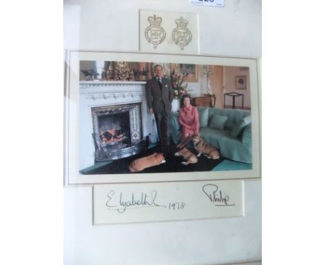 A framed and glazed image of Her Majesty The Queen and Prince Philip in Drawing Room with three corgis adapted from the 1978 