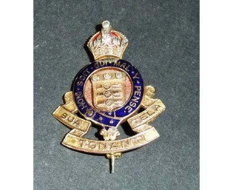 A 9 carat gold and enamel decorated Royal Artillery pin set with small diamonds, 3 cm x 2.3 cm, 6.9 g