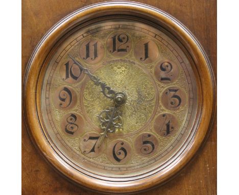 A late 19th Century German walnut cased long case clock, the stepped hood over a circular dial inscribed "C Jägermann Nacht. 