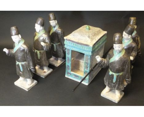 A Ming Dynasty glazed pottery sedan chair group, polychrome decorated in dark ochre and turquoise, comprising sedan chair and