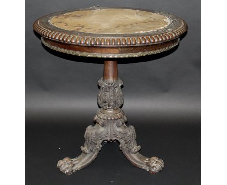 A Regency rosewood centre table by Gillows of Lancaster, the circular top with beaded edge, brass inlaid border and central c