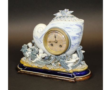 A fine and rare Doulton glazed pottery cased clock, modelled by George Tinworth and decorated by Hannah Barlow depicting a sc