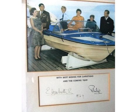 A framed and glazed image of Her Majesty The Queen with children in pony and trap, Prince Charles holding the pony adapted fr