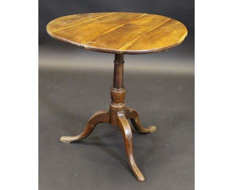 A 19th Century yew tea table, the circular snap top on bird cage pedestal to cabriole tripod base, 69.5 cm diameter x 69 cm h