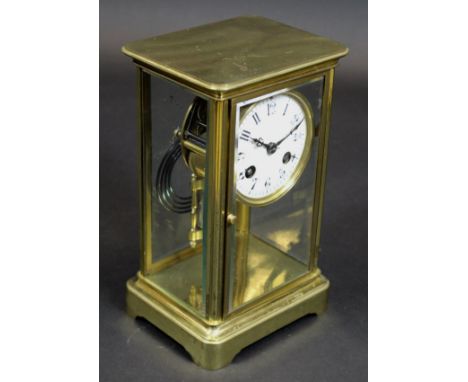 A late 19th Century French brass cased four glass mantel clock, the eight day movement with white enamelled dial and Arabic n