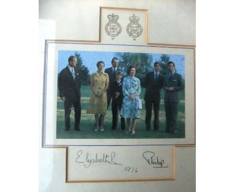 A framed and glazed image of the Royal Family with Captain Mark Phillips adapted from the 1976 Christmas card signed (probabl