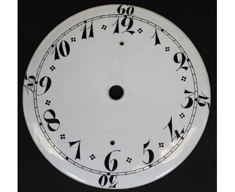 A rare late 18th Century Delft clock face, cream ground with Arabic numerals in black, 21.5 cm diameter CONDITION REPORTS Som