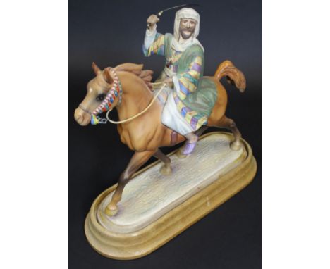 A Beswick figure of a Bedouin Arab warrior on horseback, No'd. 2275 to base, 26.5 cm long, raised on an oak plinth stand COND