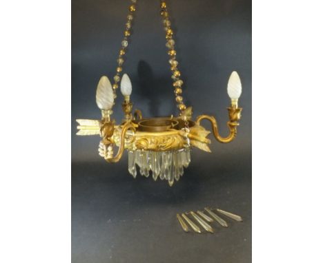An early 20th Century gilt metal and glass hanging ceiling light of three branches with feathered arrow decoration, 42 cm dia