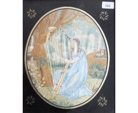 An early 19th Century English School "Woman playing harp" needlework study with painting on silk, in verre eglomise frame, ma