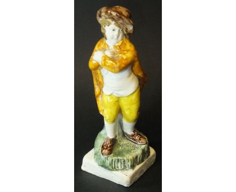 A circa 1790 Staffordshire Pearlware figure of "Winter" as a man in cloak and hat, 19 cm high 