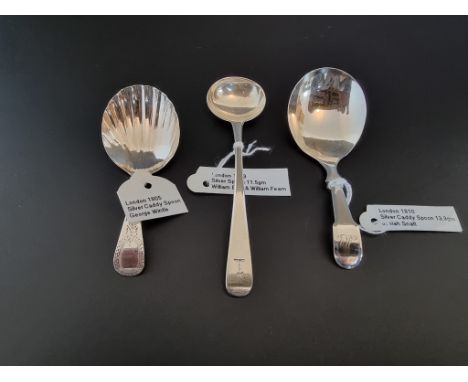 Three silver caddy spoons, London 1810, 1805 and 1823, total weight 32g. 