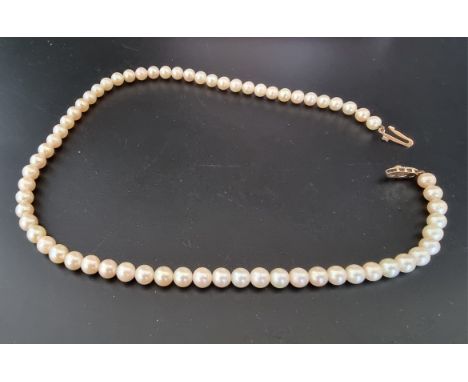 A pearl necklace, clasp stamped '375',&nbsp;44cm, boxed. 