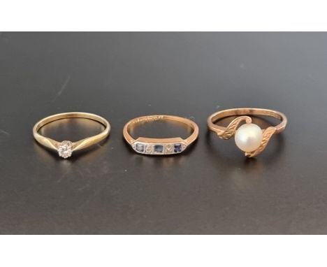 A yellow metal diamond solitaire ring, stamped 585; together with a yellow metal ring set three synthetic sapphires and four 