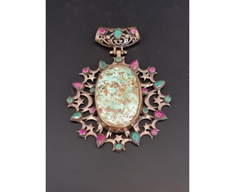 A vintage white metal and gold plated pendant, set central ceramic plaque in an openwork setting set coloured paste gems, 7cm