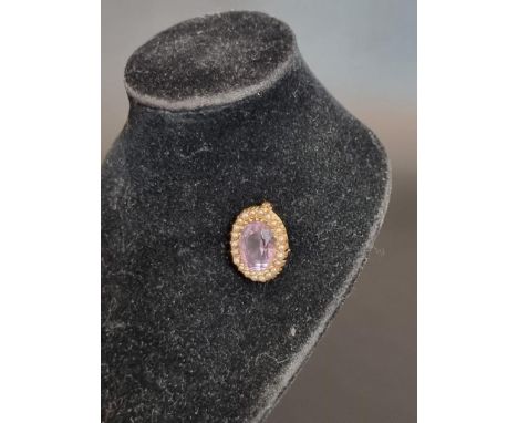 An amethyst and pearl oval brooch, stamped 15ct, 2cm. 
