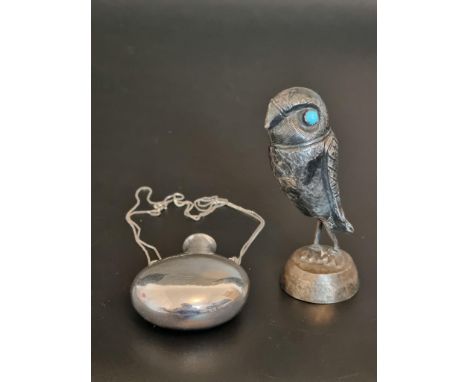 A necklace, stamped 925, with attached flask, 63mm high; together with a model of an owl, on later associated base, 8.3cm hig
