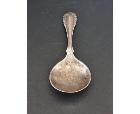 A Georg Jensen 'Lily of The Valley' silver caddy spoon,&nbsp;stamped .830, Copenhagen 1926, 11.6cm, 21g. 