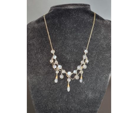 A vintage yellow metal moonstone fringe necklace, 41cm. 