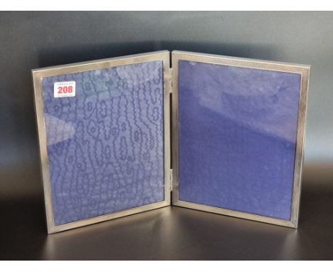 A silver engine turned double photograph frame, Birmingham 1957, 26cm high x 21cm wide. 