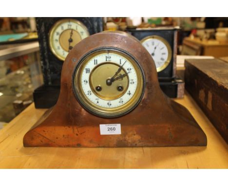 A COPPER CASED NAPOLEON HAT MANTEL CLOCK