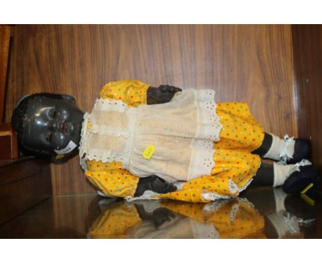 AN UNUSUAL BLACK VINTAGE DOLL