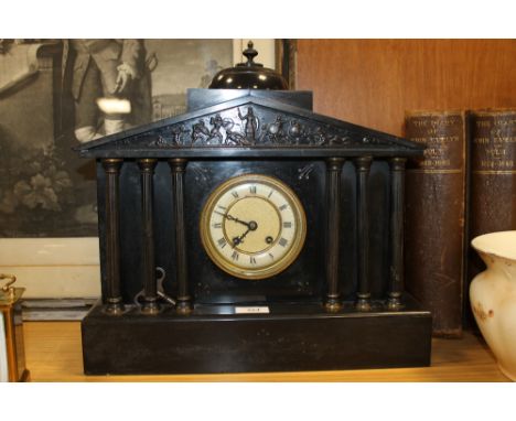 A SLATE MANTEL CLOCK WITH FIGURATIVE DETAIL