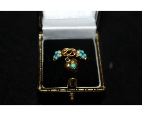 AN UNUSUAL LADIES DROPPER RING SET WITH TURQUOISE