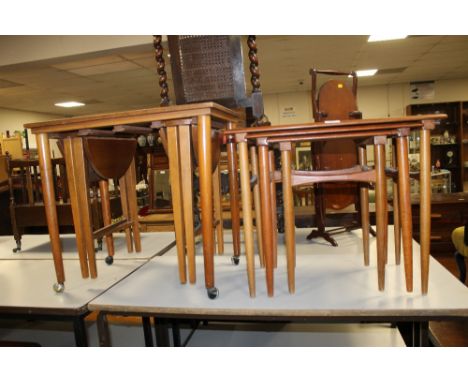 A VINTAGE TEAK NEST OF TABLES & ANOTHER PART NEST OF TABLES (2)