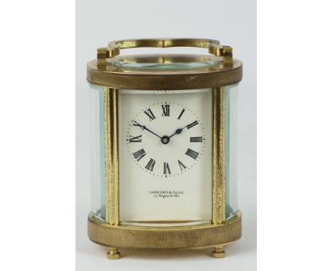 Mid 20th century brass carriage clock, oval form,  'Garrard & Co. LTD',    Condition Report   Click here for further images, 