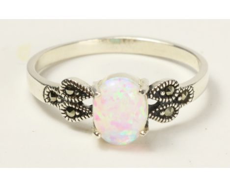 Opal and marcasite ring stamped 925   Condition Report   Click here for further images, condition, auction times & delivery c