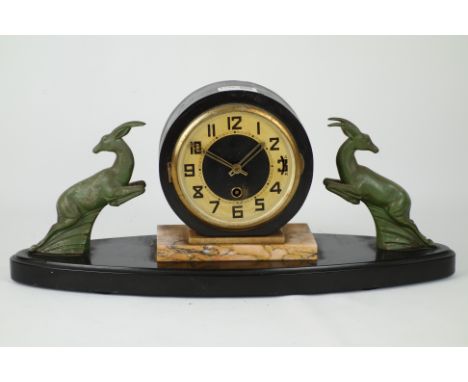 Art Deco period marble and slate mantel clock, circular dial, two leaping gazelle figures, W46cm   Condition Report   Click h