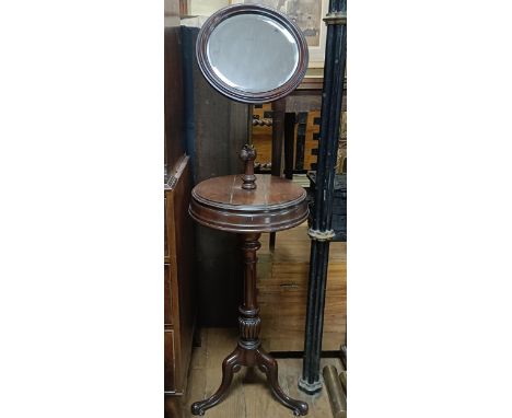 A 19th century mahogany adjustable washstand, on a tripod base, 42 cm diameter