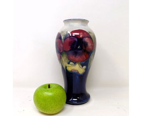 A Moorcroft pottery vase, of baluster form, decorated pansies, 23 cm highSome crazing, no visible, chips, cracks or restorati