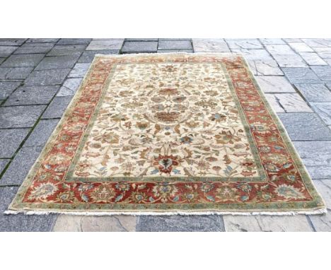 A cream ground rug, 275 x 180 cm