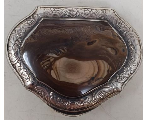 A George III silver coloured metal snuff box, the lid with engraved decoration and inset an agate panel, apparently unmarked,