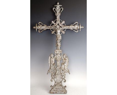 A cast iron crucifix, 83 x 40 cm, a silver plated cross, 60 cm high, and a painted metal cross, 47 cm high (3)