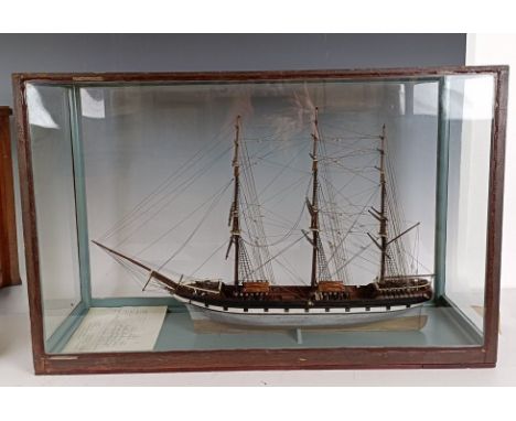 A model of a three masted sailing ship, in a glass case, 74 cm wide