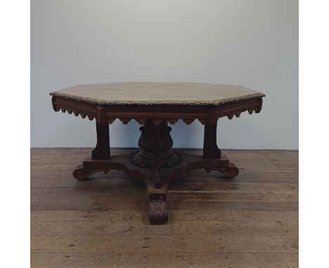 A Victorian carved oak octagonal library table, on a carved column support to a shaped base, 140 cm diameterIn need of restor