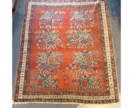 An Hariz red ground rug, 180 x 158 cm