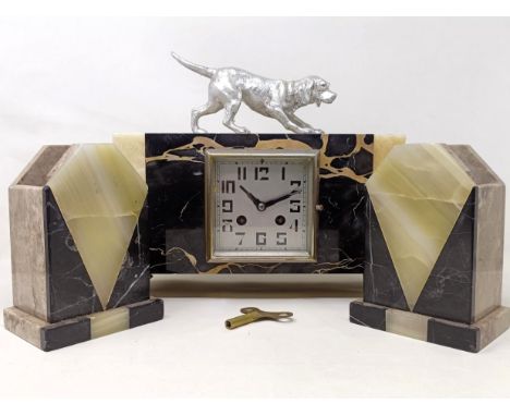 An Art Deco clock garniture, the clock with a dog finial, 30 cm wide (3)