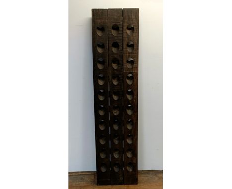 A stained wood wall mounted wine rack, 150 x 37 cm