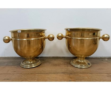 A pair of brass champagne buckets, 28 cm diameter (2)