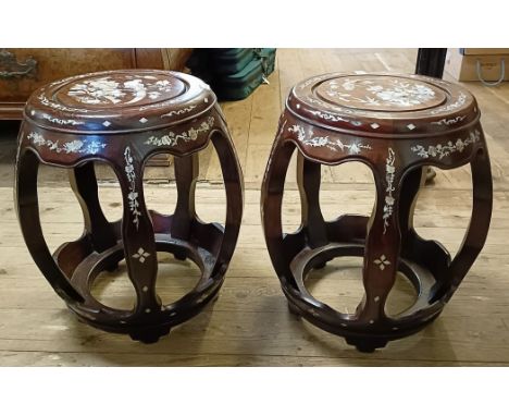 Two similar Chinese hardwood stools, with mother of pearl inlaid decoration, slight loss