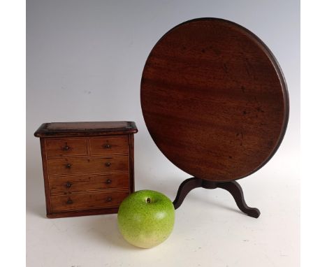 A miniature/apprentice piece tripod table, and a money box, in the form of a chest of drawers (2)