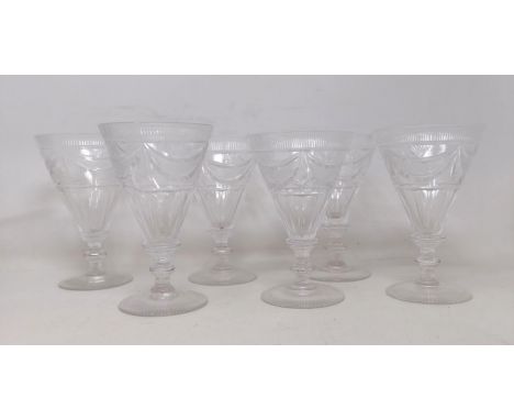 A set of six wine glasses, with conical bowls and cut swag decoration, a set of six wine glasses, with floral decoration and 