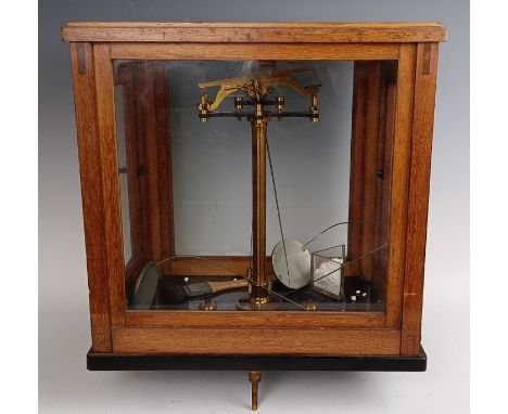 A set of laboratory scales, in a mahogany case, 37 cm wide