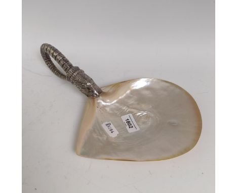 A Russian style mother of pearl and silver coloured metal caviar dish, the handle in the form of a serpentHandle testing as s