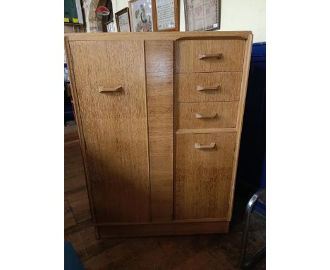 An Ernest Gomme gentleman's dresser, with a cupboard door and drawers, 89 cm wide